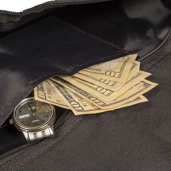 Hidden pocket inside the coat hanger diversion safe holding cash and a watch.